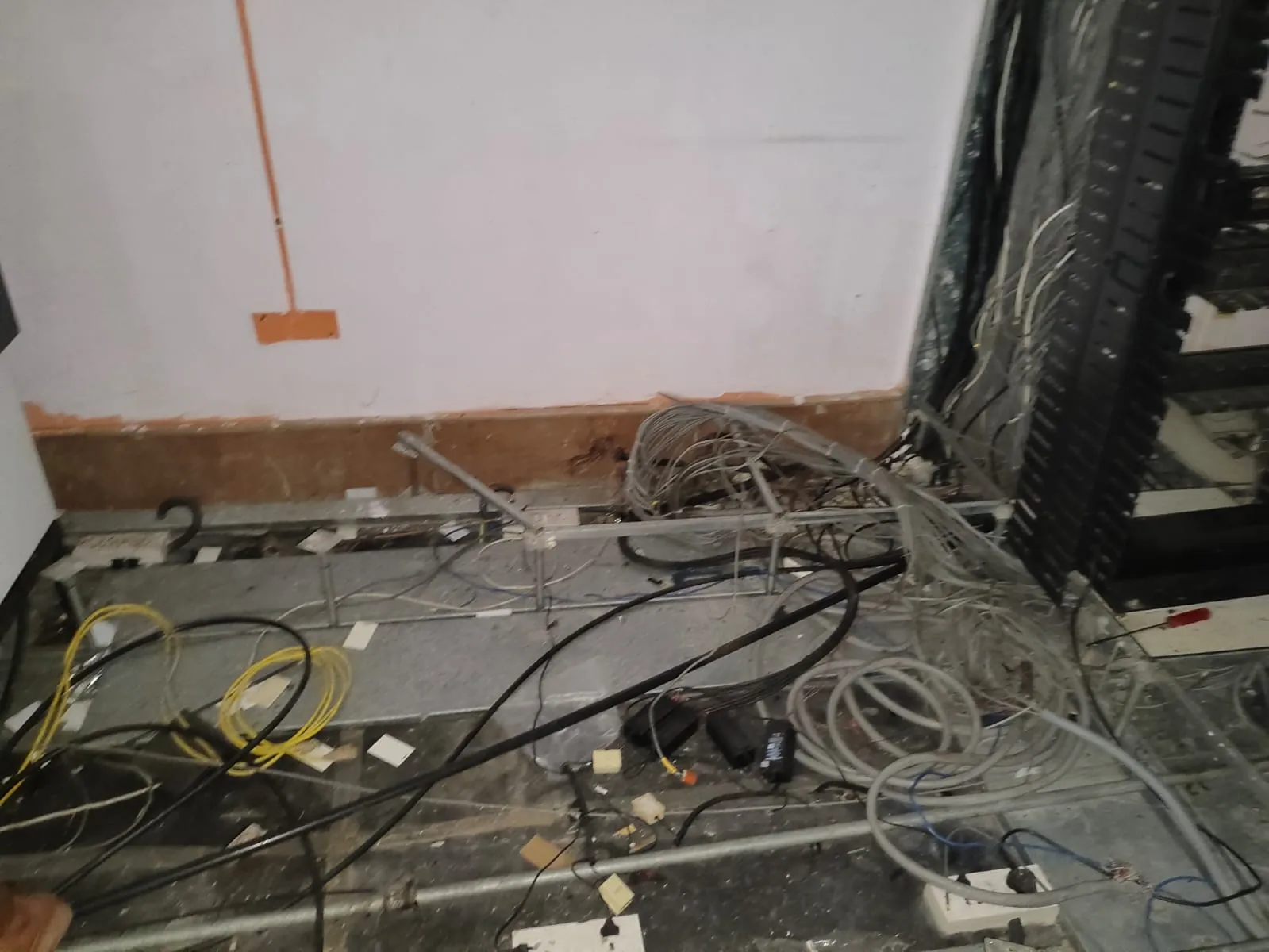 Dismantled multi-pair cables organized neatly during an office shifting services MG Road project.